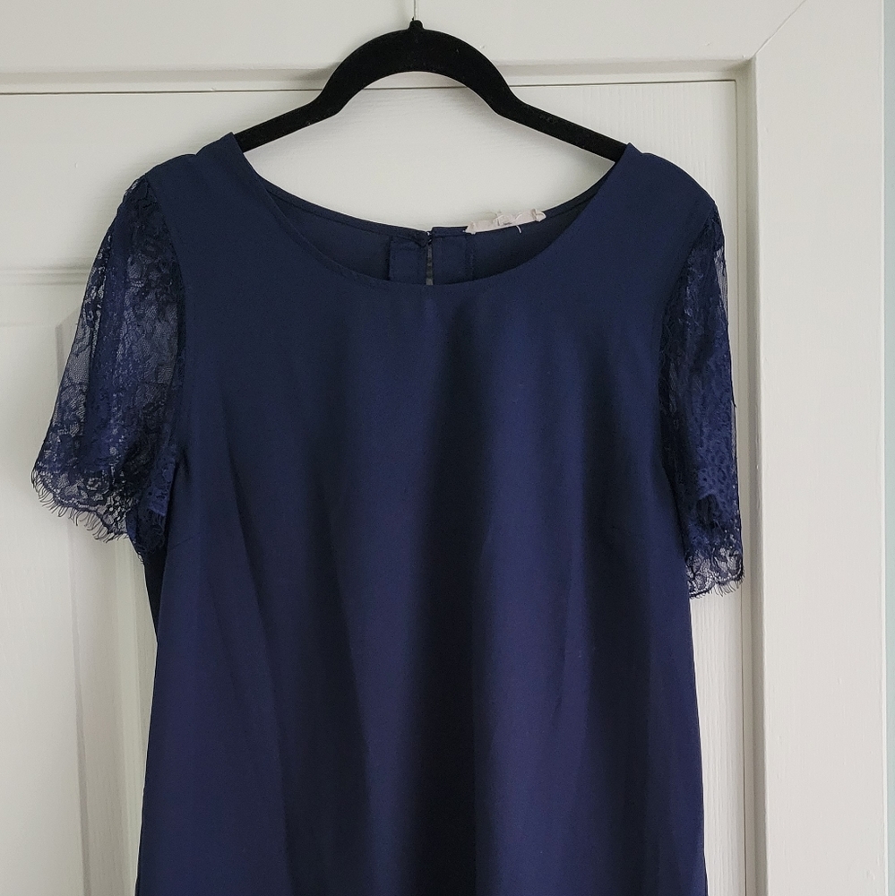 Navy blue blouse with lace sleeves